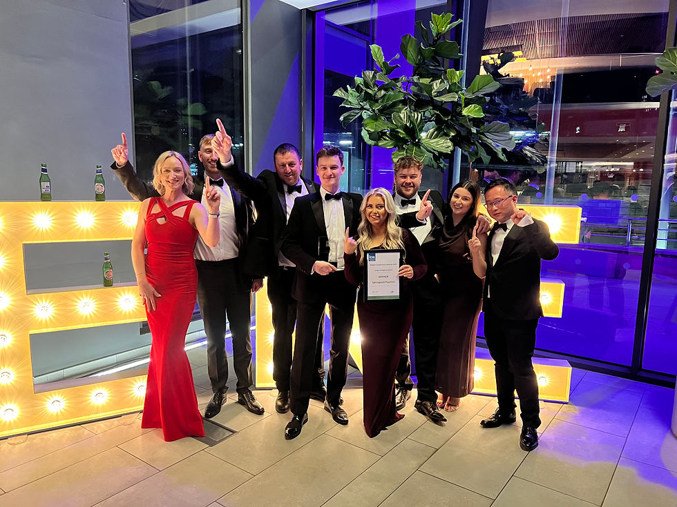 People celebrating an award win