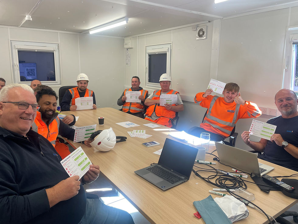 People in high-vis give a thumbs up