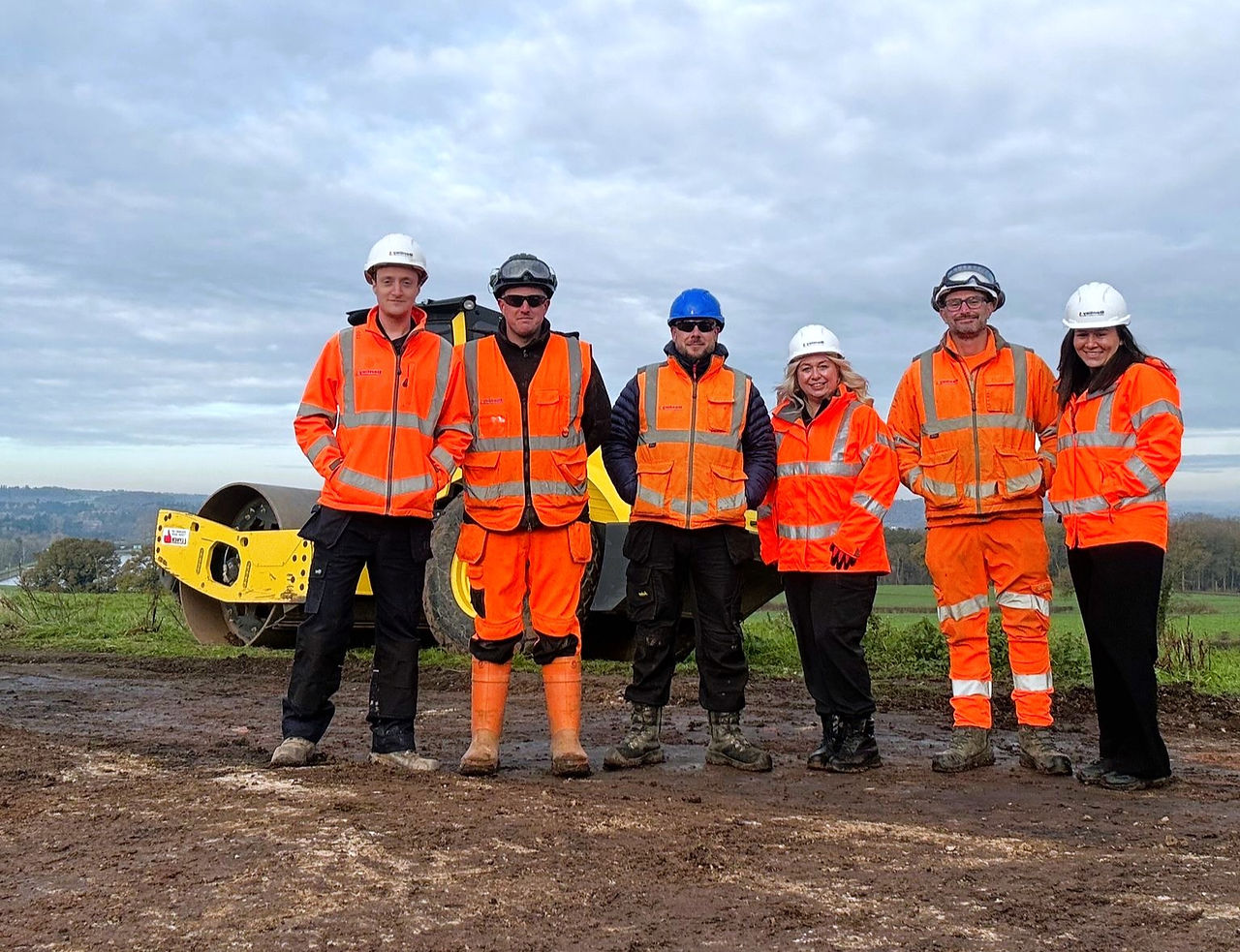 A group of colleagues from Mott MacDonald Bentley on site in construction PPE