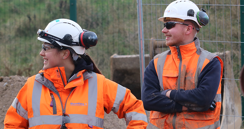 Two MMB site colleagues smiling