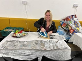 An MMB colleague makes sleeping bags from recycled sleeping bags.